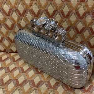 Beautiful rhinestone skull hard clutch purse.
